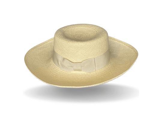 The Pomona is our signature authentic Panama in a fine-weave with a broad brim, suited to a day at the markets or watching the big race. The brim is soft enough to turn up or down, partly or all around. Natural Panama with an ivory, vintage grosgrain band and flat bow. Noosa Sundays