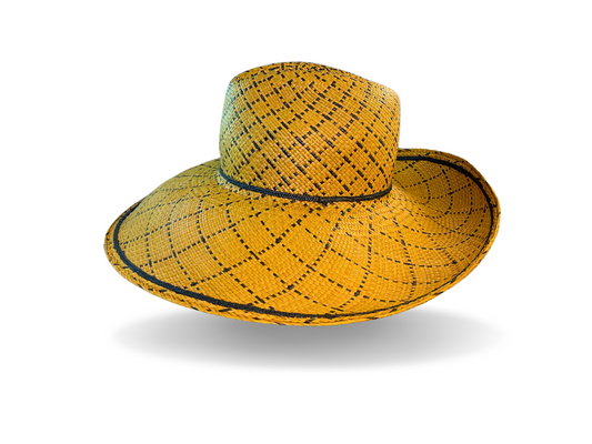 Authentic hand-woven Ecuadorian Panama in golden-yellow, finished with a French navy straw braid band and bow. The broad brim is turned down at the front and up at the back, and reinforced to keep its shape.  Noosa Sundays