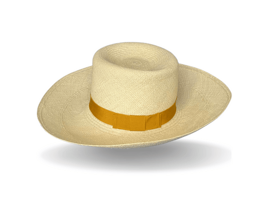 The Pomona is our signature authentic Panama in a fine-weave with a broad brim, suited to a day at the markets or watching the big race. The brim is soft enough to turn up or down, partly or all around. Natural Panama with a golden-yellow, vintage grosgrain band and flat bow. Noosa Sundays
