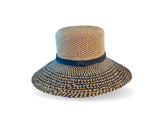 Authentic hand-knotted straw in natural and French Navy, finished with a French navy straw-braid band. The broad brim is turned down and reinforced to keep its shape. Noosa Sundays 